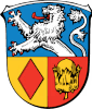 Wappen mit Löwe, Raute und Baumstumpf. Bezug zu "Karl Kaps", Mikroskope "Microscopes made in Germany".